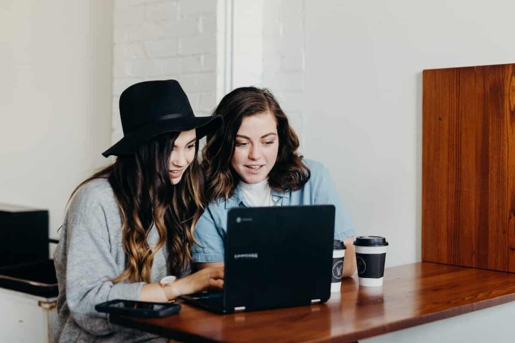 Is Chegg Cheating? 2 students looking at a computer