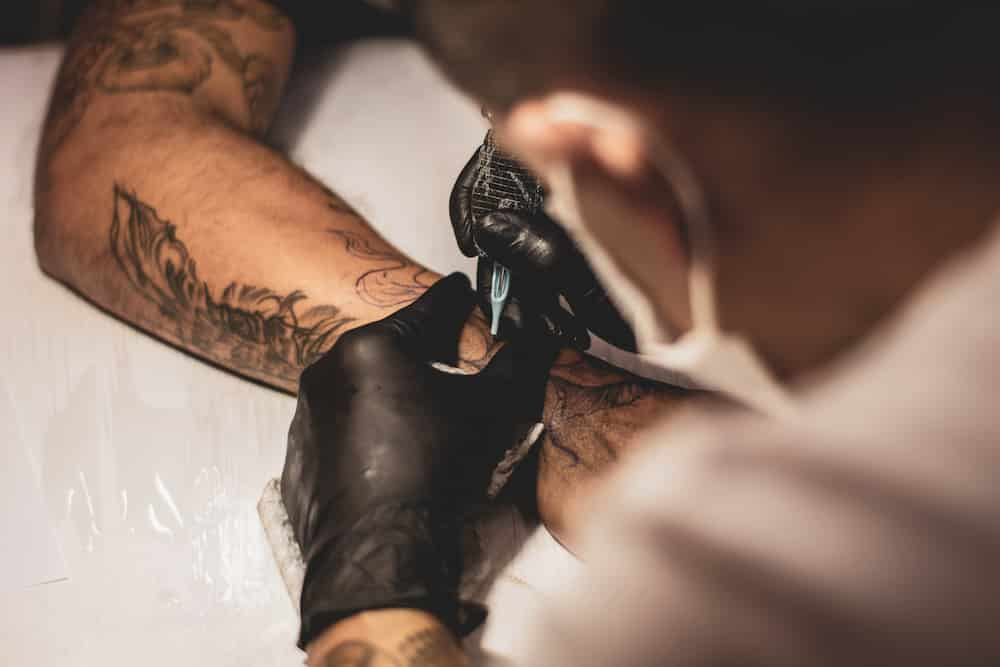 Are visible tattoos unprofessional Would a visible but not extreme ie  facial tattoo such as one on a hand or emerging from a sleeve count  against someone you met in a professional